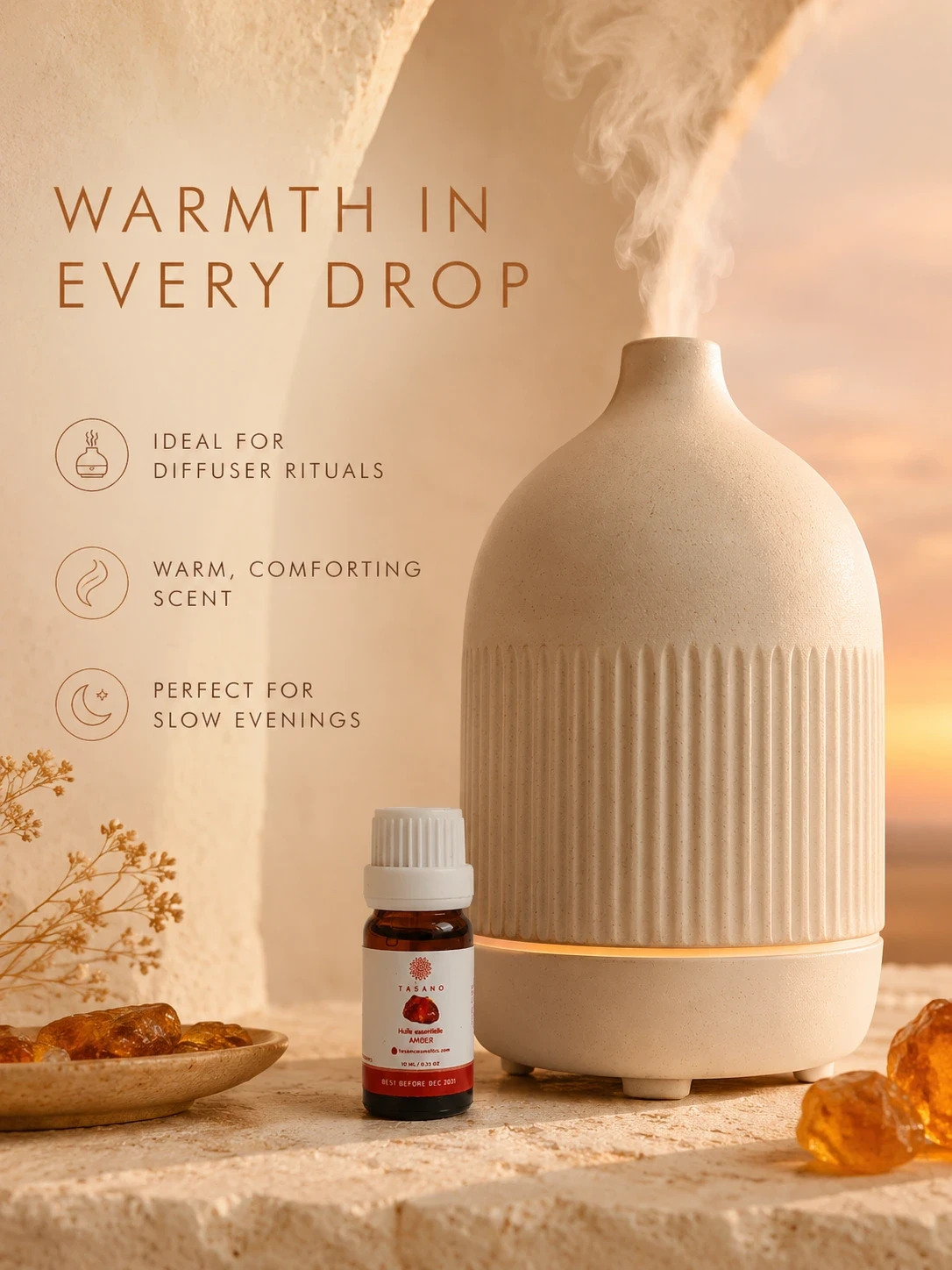 TASANO amber essential oil beside a modern diffuser, creating a warm comforting atmosphere for home fragrance.