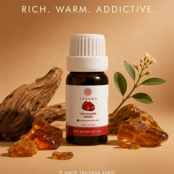 TASANO amber essential oil bottle surrounded by amber resin-inspired elements in a warm oriental scent profile. TASANO amber essential oil bottle surrounded by amber resin-inspired elements in a warm oriental scent profile.
