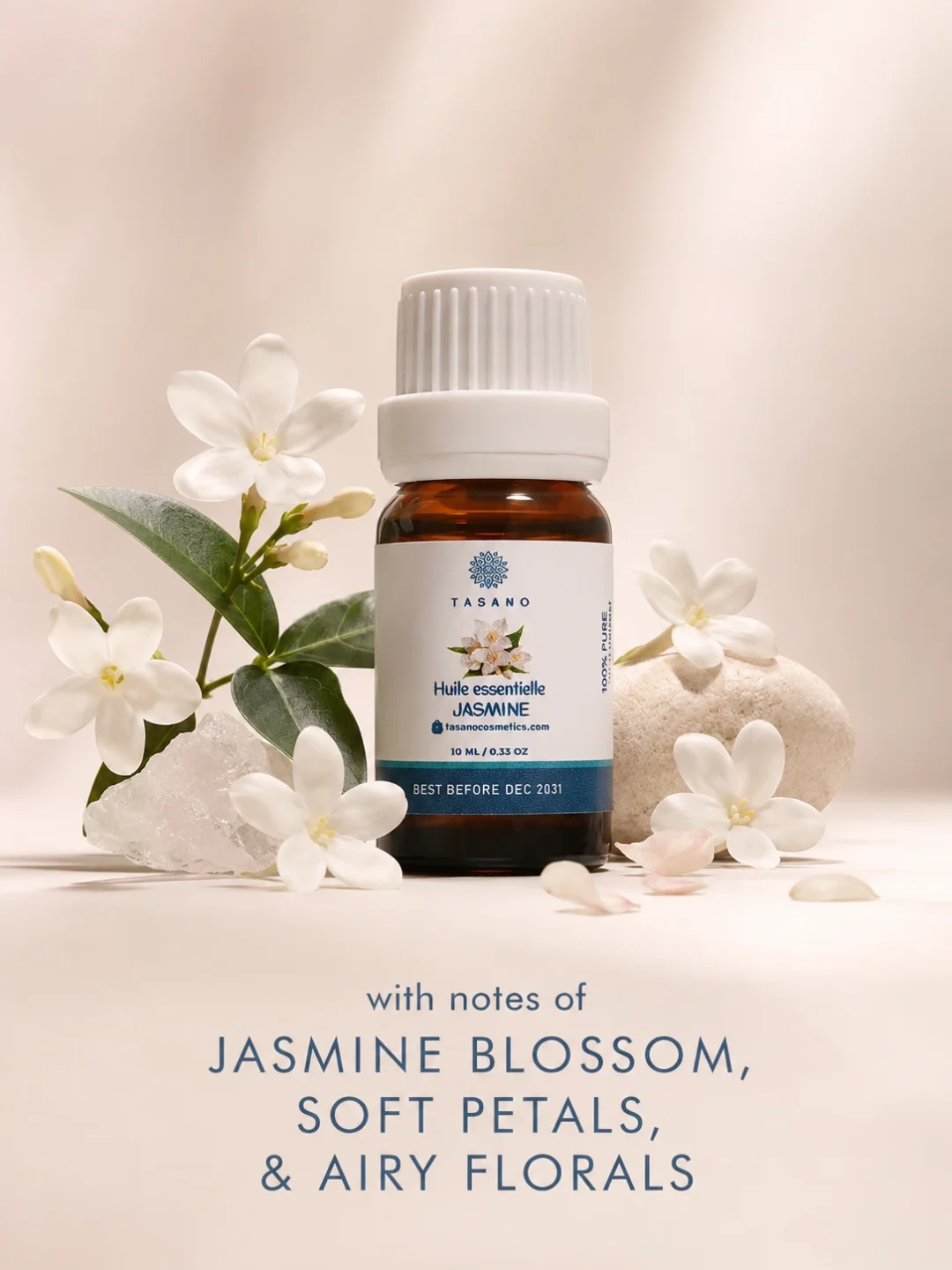 TASANO jasmine essential oil bottle surrounded by jasmine flowers in a delicate floral scent profile. TASANO jasmine essential oil bottle surrounded by jasmine flowers in a delicate floral scent profile.