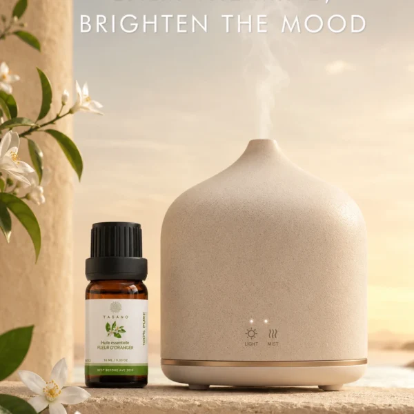 TASANO Orange Blossom Essential Oil beside an active diffuser for a soft floral Moroccan aromatherapy atmosphere. TASANO Orange Blossom Essential Oil beside an active diffuser for a soft floral Moroccan aromatherapy atmosphere.