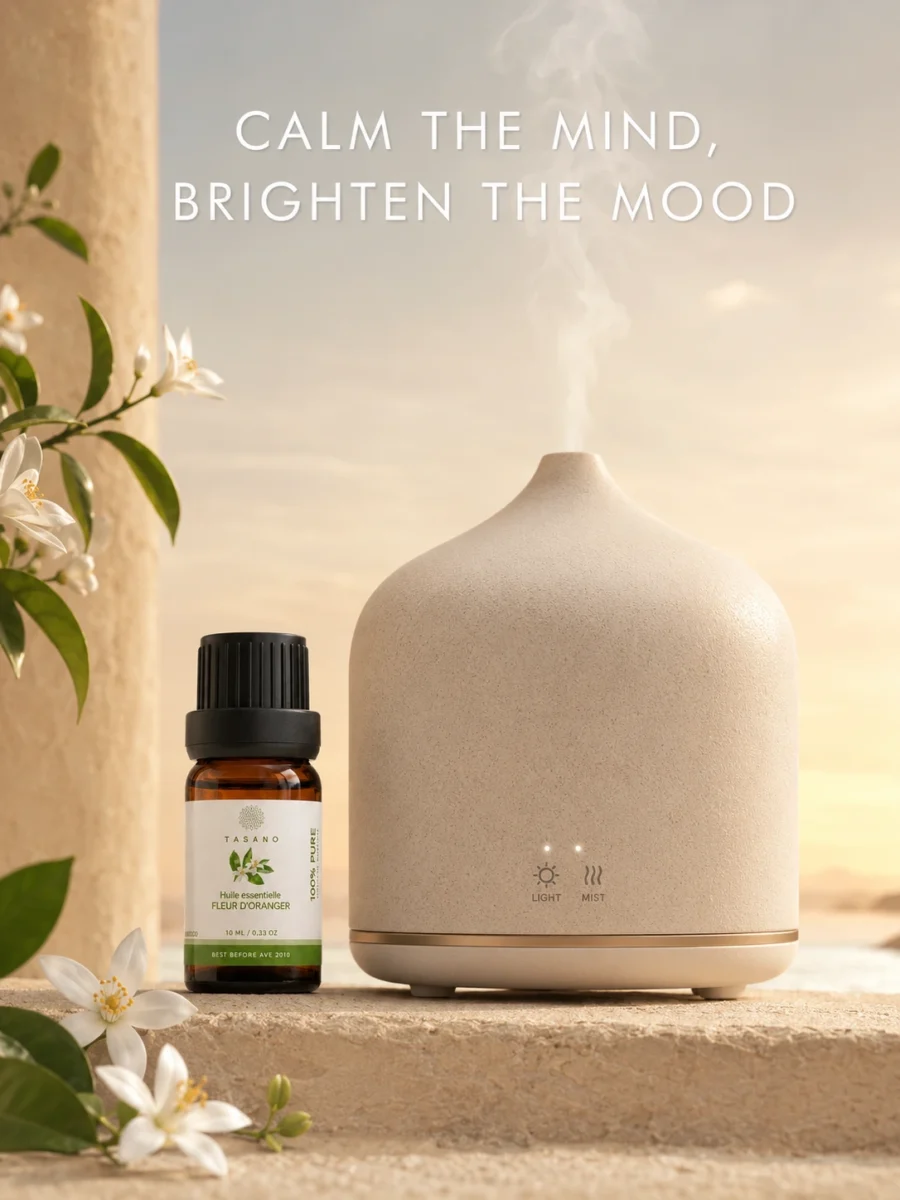 TASANO Orange Blossom Essential Oil beside an active diffuser for a soft floral Moroccan aromatherapy atmosphere.