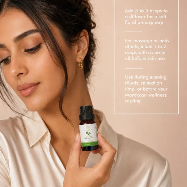 TASANO orange blossom essential oil bottle held by a Moroccan model with clear diffuser use instructions. TASANO orange blossom essential oil bottle held by a Moroccan model with clear diffuser use instructions.