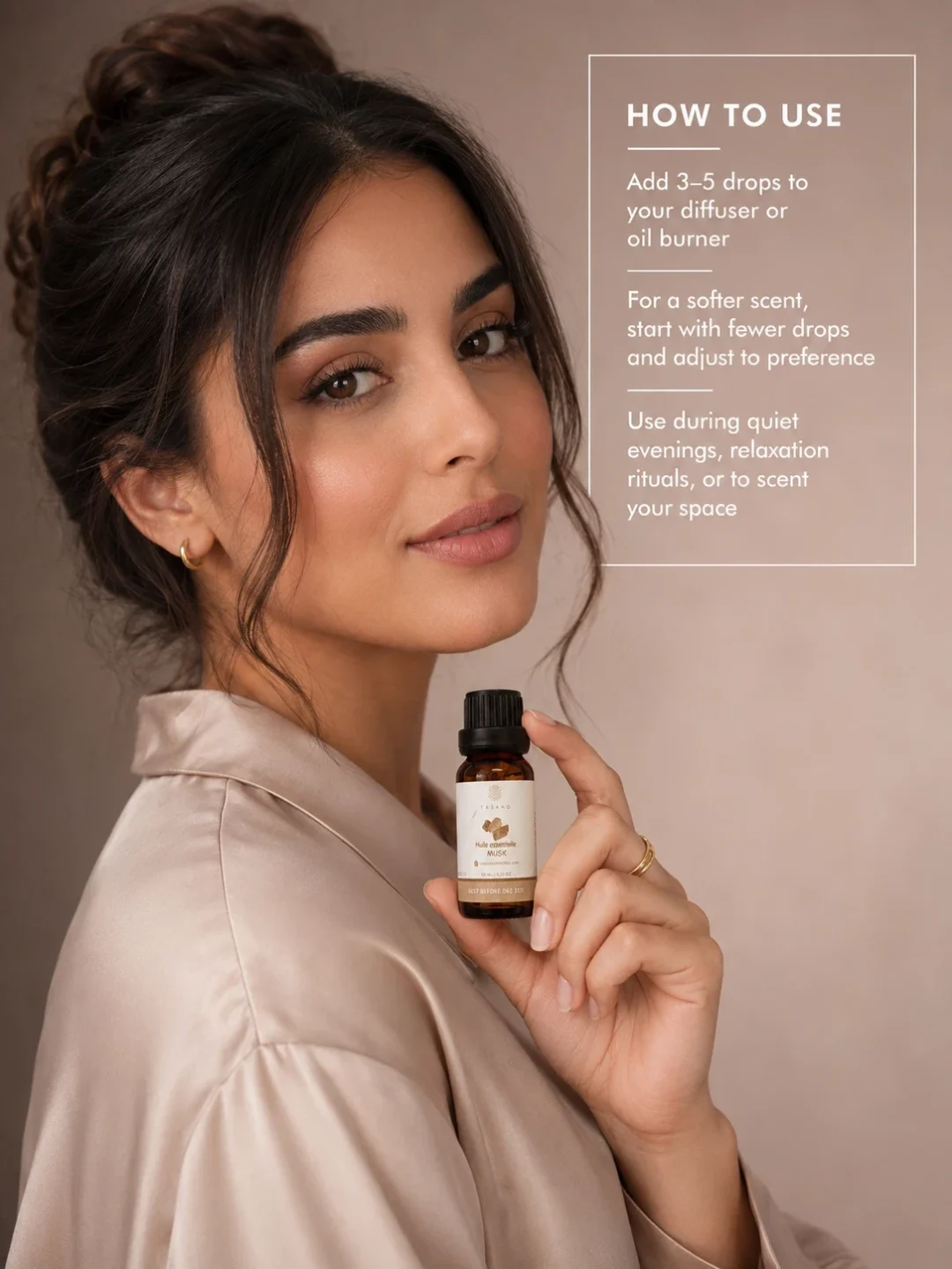 Moroccan model holding TASANO Musk essential oil with clear diffuser instructions showing how to add a few drops to water for a soft refined scent.
