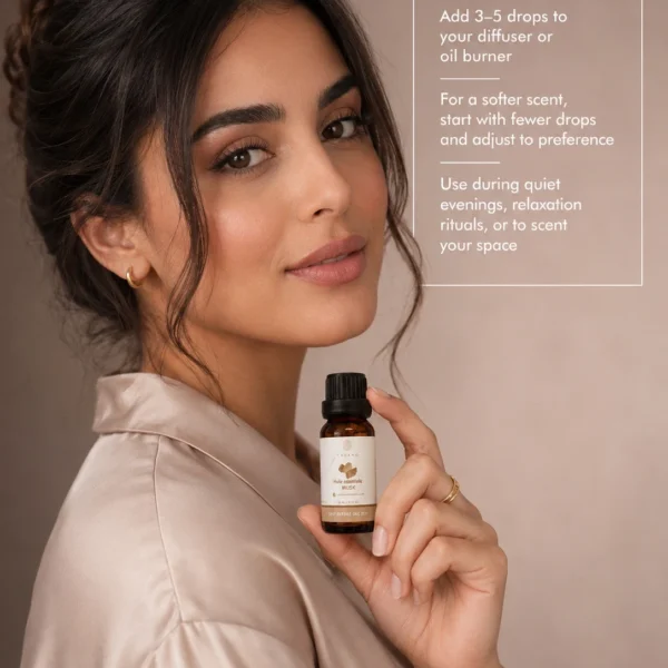 Moroccan model holding TASANO Musk essential oil with clear diffuser instructions showing how to add a few drops to water for a soft refined scent.