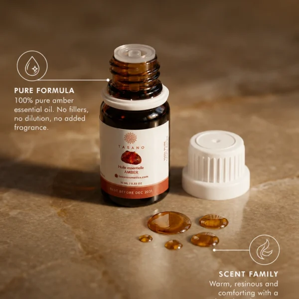 TASANO Amber Essential Oil with golden oil drops, 100% pure formula callout, and warm resinous scent profile.