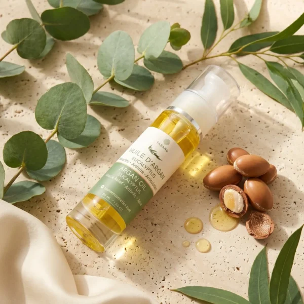 TASANO Eucalyptus Argan Body Oil bottle with eucalyptus leaves argan nuts and golden oil TASANO Eucalyptus Argan Body Oil bottle with eucalyptus leaves argan nuts and golden oil