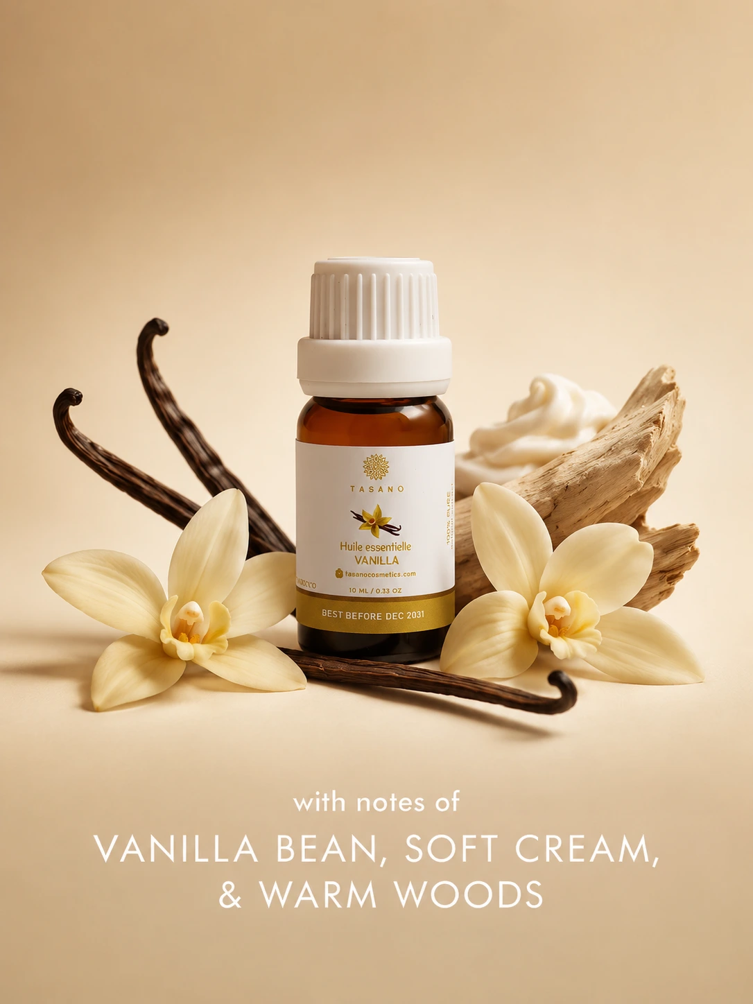 TASANO Vanilla essential oil bottle surrounded by vanilla flowers and vanilla pods on a creamy background showing its warm sweet gourmand scent profile.