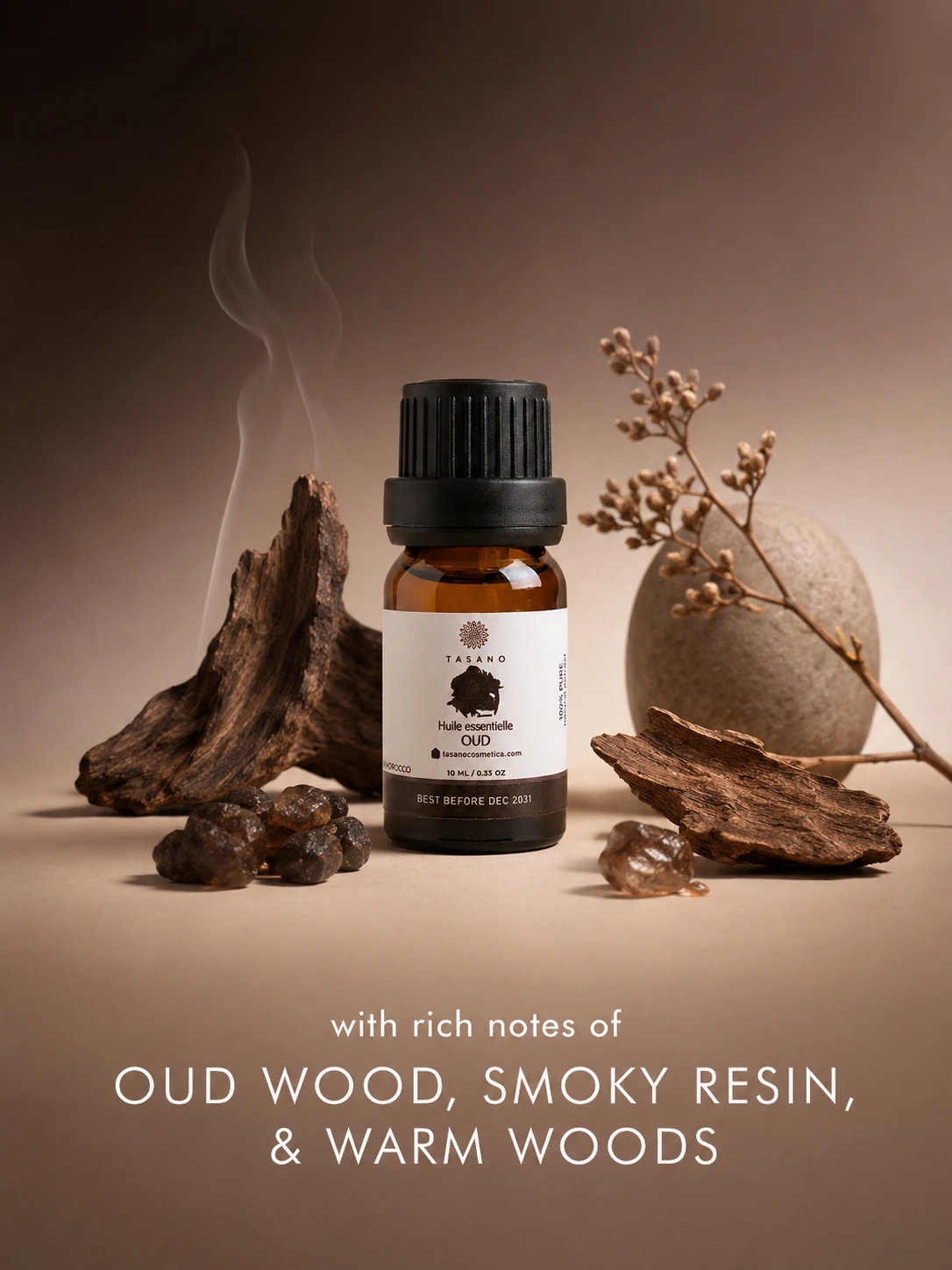 TASANO Oud essential oil bottle surrounded by oud wood elements on a deep warm background showing its rich woody, smoky and luxurious scent profile.