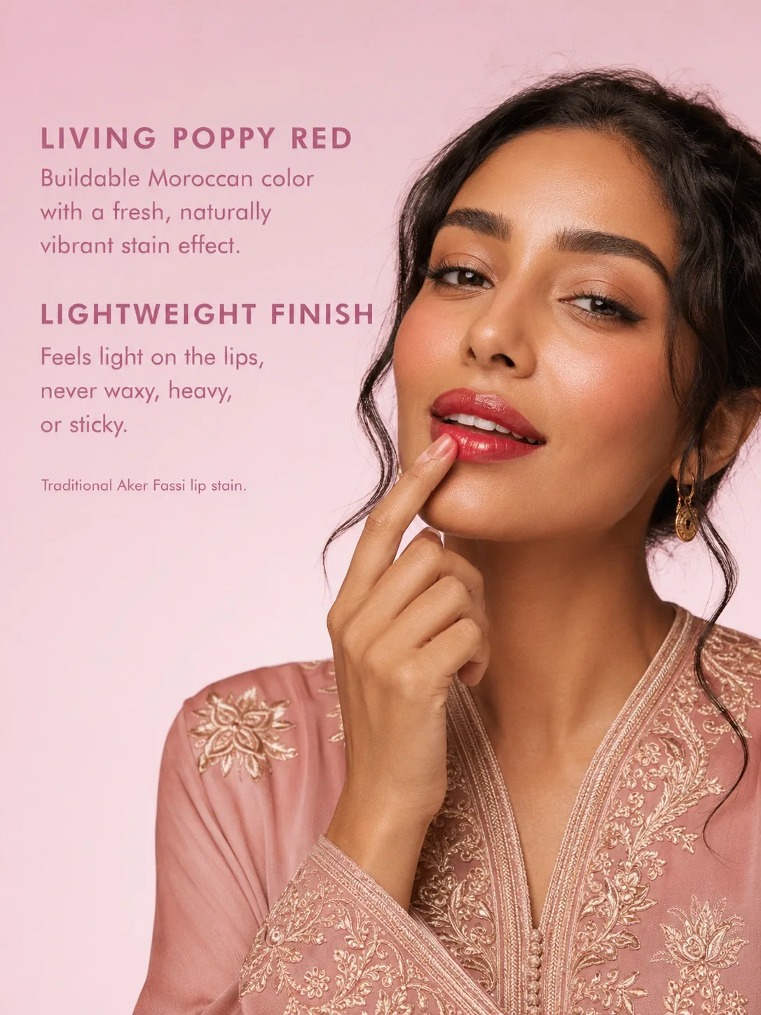 Moroccan model applying TASANO Aker Fassi lipstick with a living poppy red stain and lightweight finish